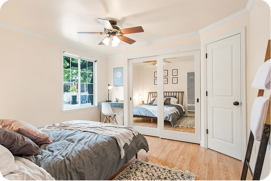 bedroom-with-mirrors-on-closet-door-dennis-ma