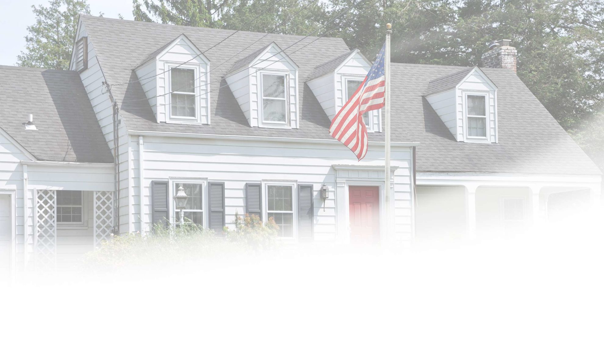 front-of-white-home-with-flag-pole-dennis-ma