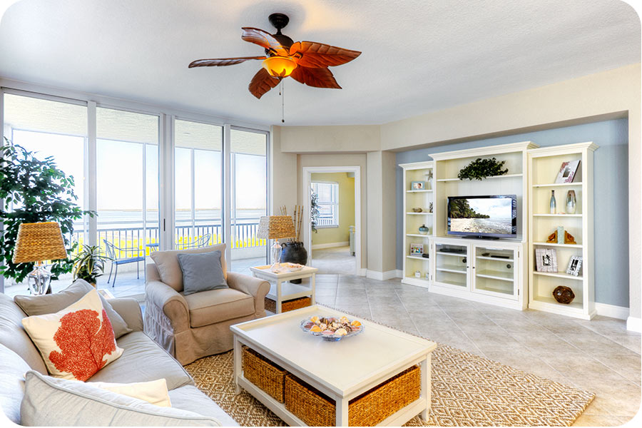 living-room-with-light-furniture-and-ceiling-fan-dennis-ma